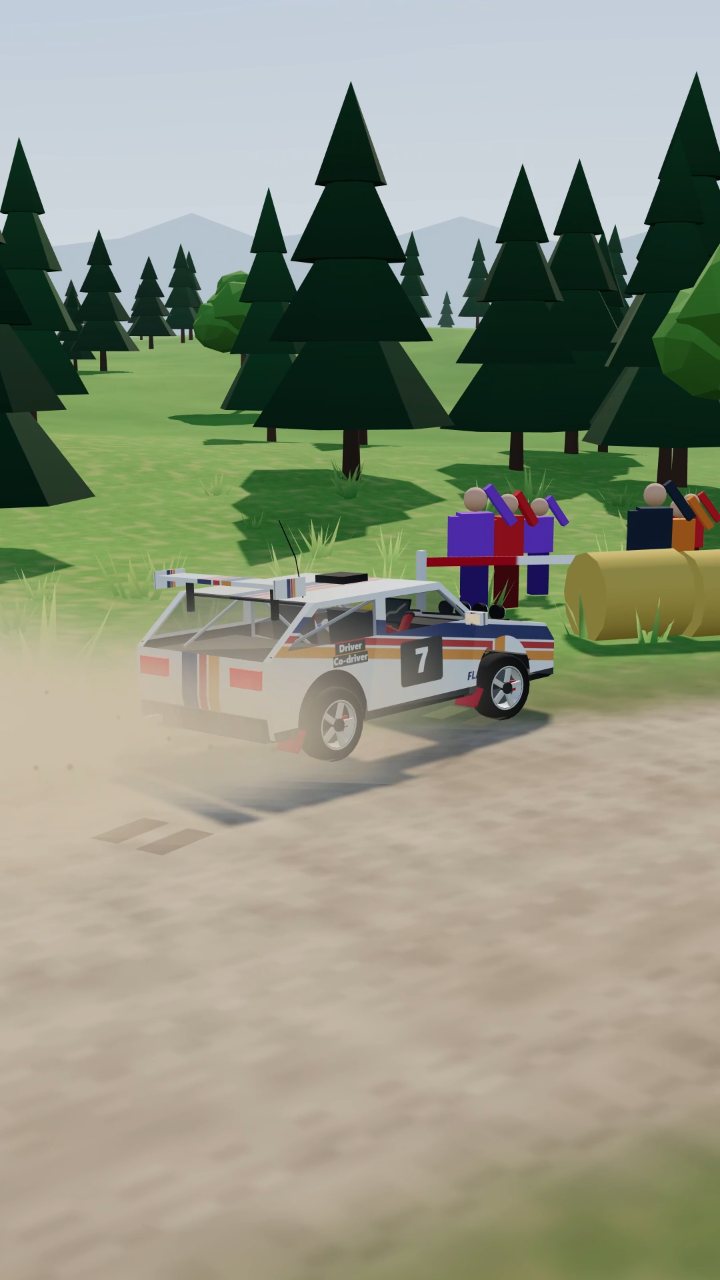 Rally car sliding into hay bales